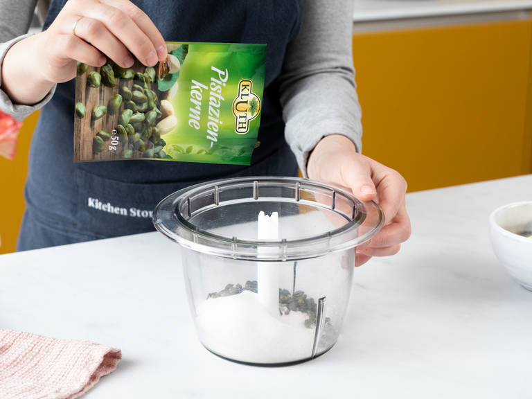 To make the pistachio crumble sheet, add flour, sugar, pistachios, and a pinch of salt to a food processor and mix until finely ground. Add butter and, with your fingertips, combine into a crumbly dough. Roll out the dough between two sheets of parchment paper until thin.Transfer to freezer and chill for approx. 30 min.
